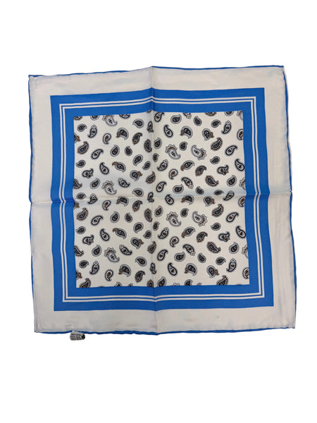 A square white bandana with a blue border and a black and gray paisley pattern in the center, laid flat on a light gray surface.